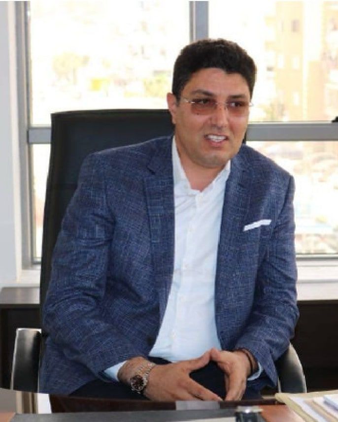 Portrait of Amen Allah Labidi, Chairman & CEO of Labidi Viandes, at his desk