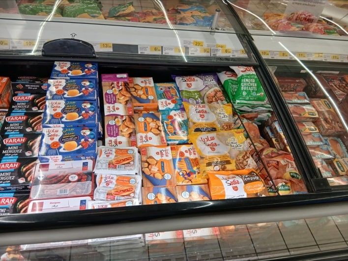 Supermarket freezer aisle stocked with Sadia products